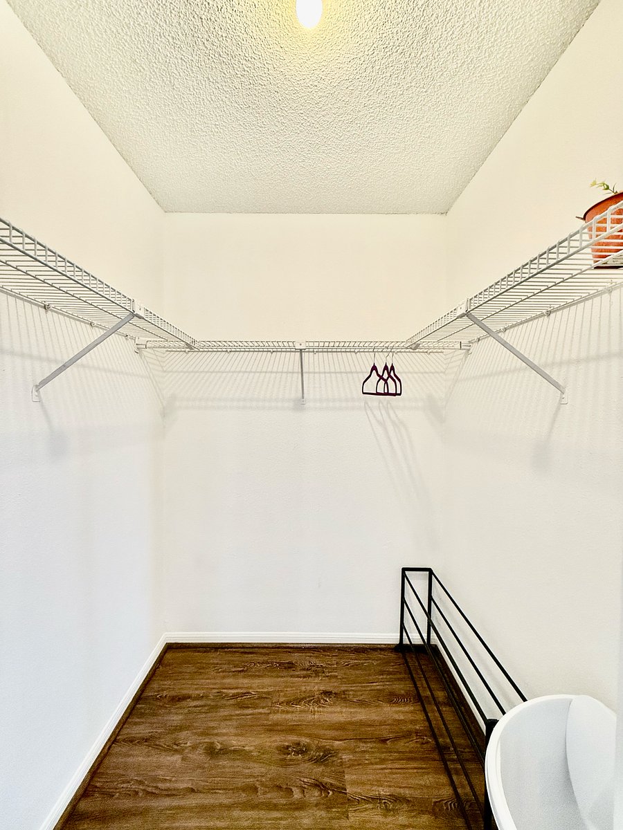Walk-in closet in secondary bedroom