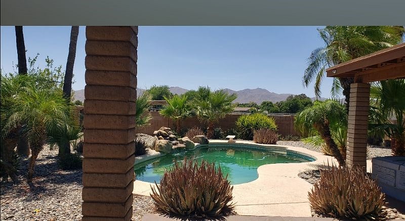 Shared Backyard with pool, hot tub, outdoor shower, view of horses, white tank mountains all on 2 acres..shared by casita and main home! No Pets in the clear pool please! 