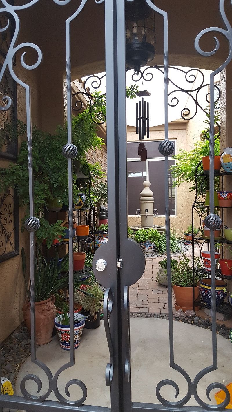 GATED COURTYARD TOWER TO FRONT ENTRY DOOR