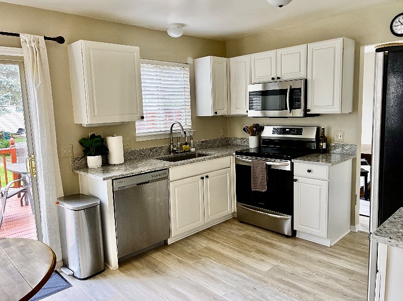 Updated kitchen with granite countertops and high-end appliances.