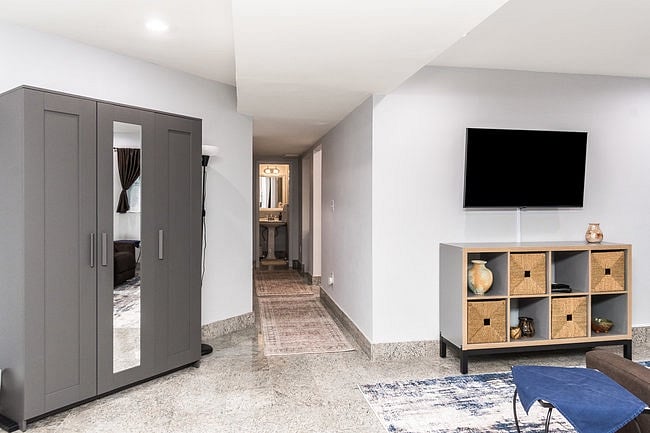 Wardrobe storage and hallway to Bathroom, Kitchen, and Dining Room