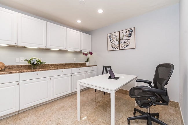 Dining Room doubles as work space with modern desk chair