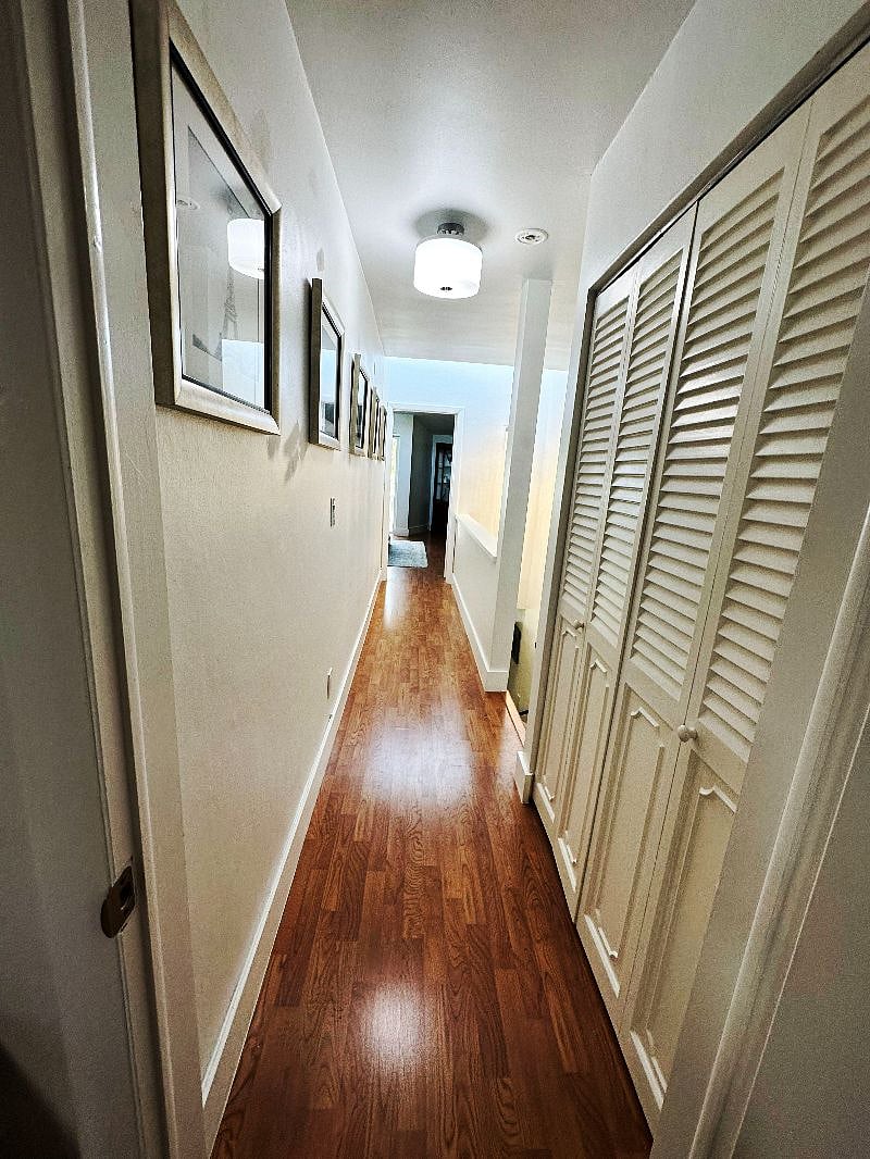 Two Upstairs Bedrooms with Private Bathrooms Separated by Large Hallway