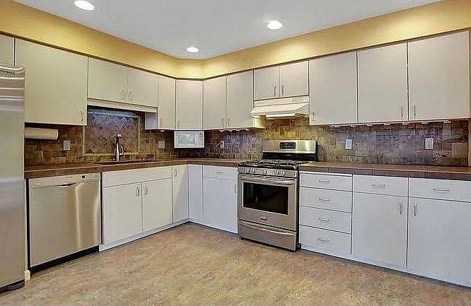 Kitchen - not yet updated and some walls are simply sheetrock until the final phase!