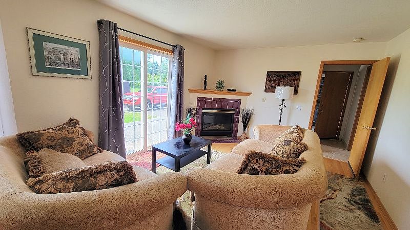 a Smart TV will be added above the fireplace soon! You can exit to the backyard from the sliding door and enjoy the outdoors!
