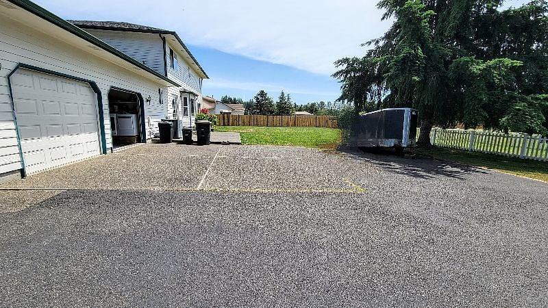 Parking for 1 car is in front of the garage door that is open in the photo (no parking inside the garage)