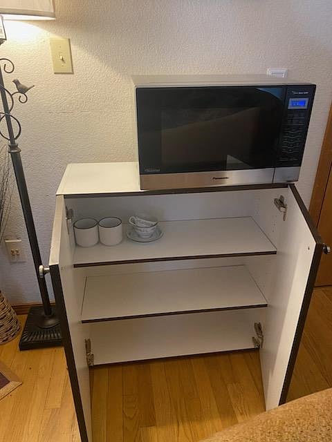 your personal microwave and cabinet, also more cabinets in the garage for your use!