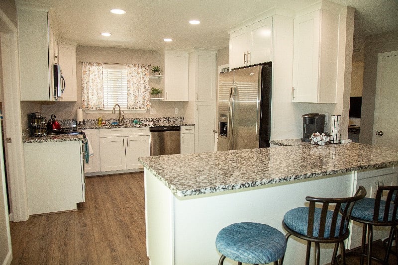 Kitchen with granite counter tops, stainless steel appliances