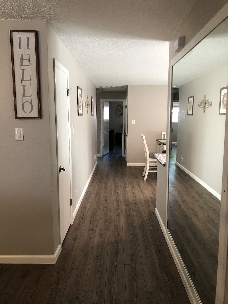 Entry way with large wall mirror