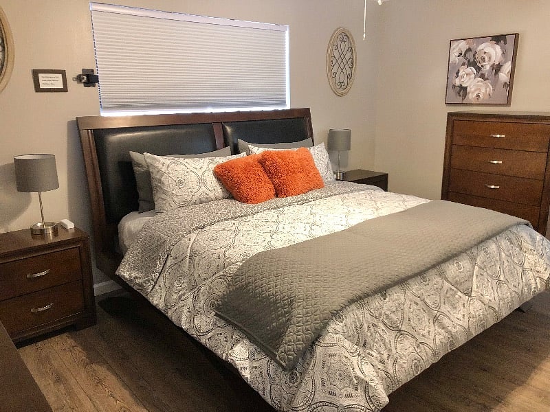 Primary bedroom with king bed, 2 night stands dresser, chest, large closet and smart fire tv.