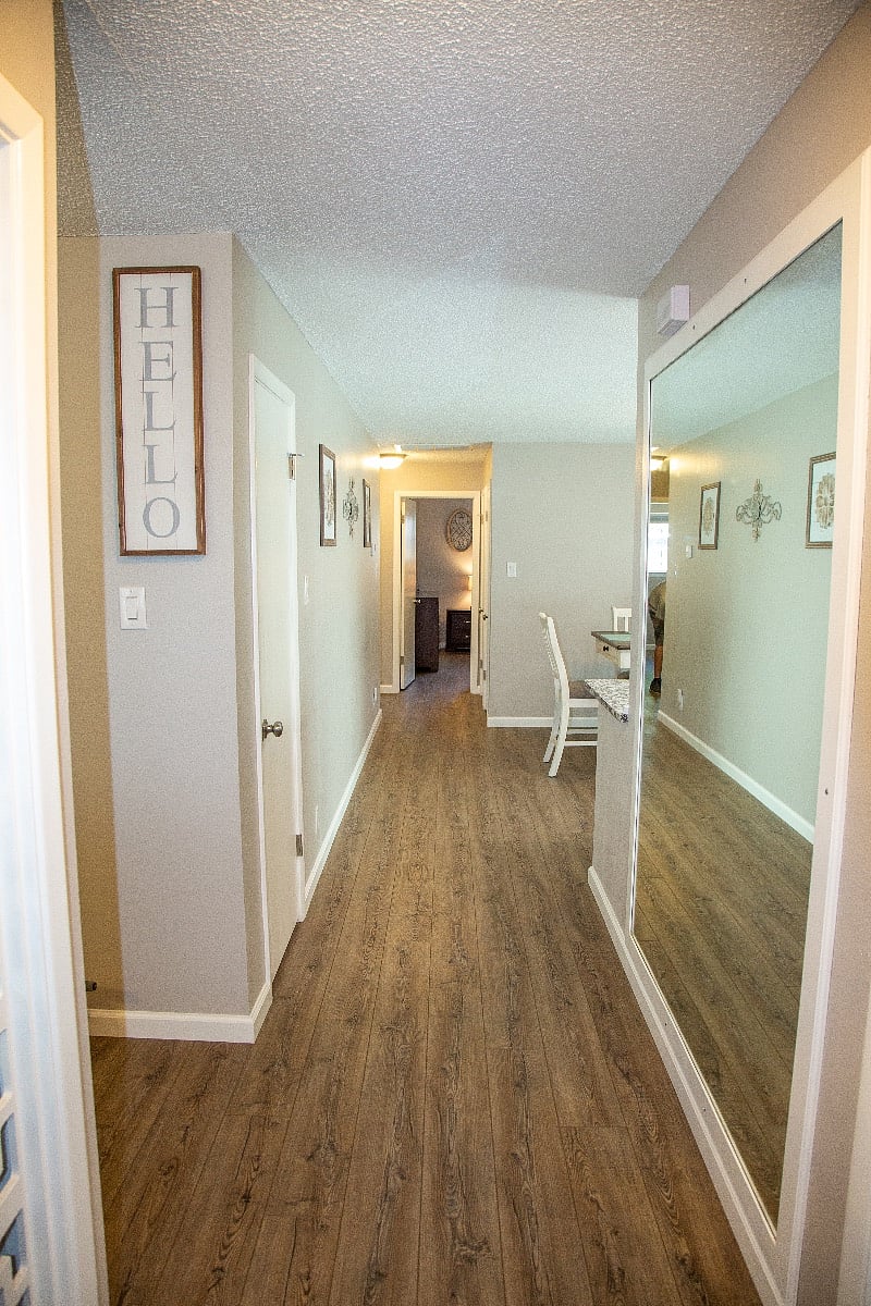 Entryway with large wall mirror