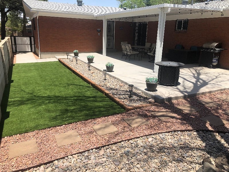 Covered back patio and artificial grass