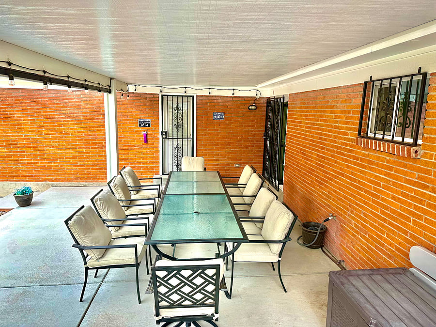 Covered back patio with table that seats 10