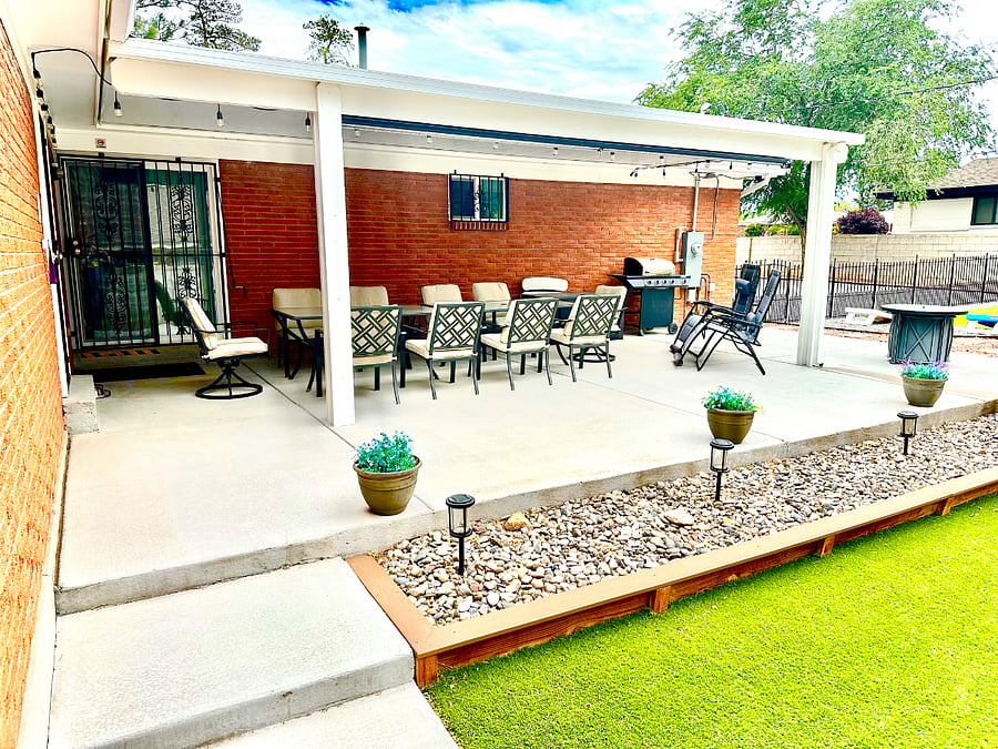 Covered back patio that seats 10. Propane BBQ grill and fire pit
