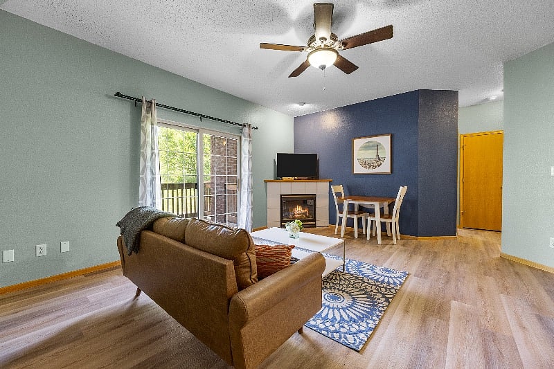 Living room with Sofa, coffee table, dining table, fireplace and TV