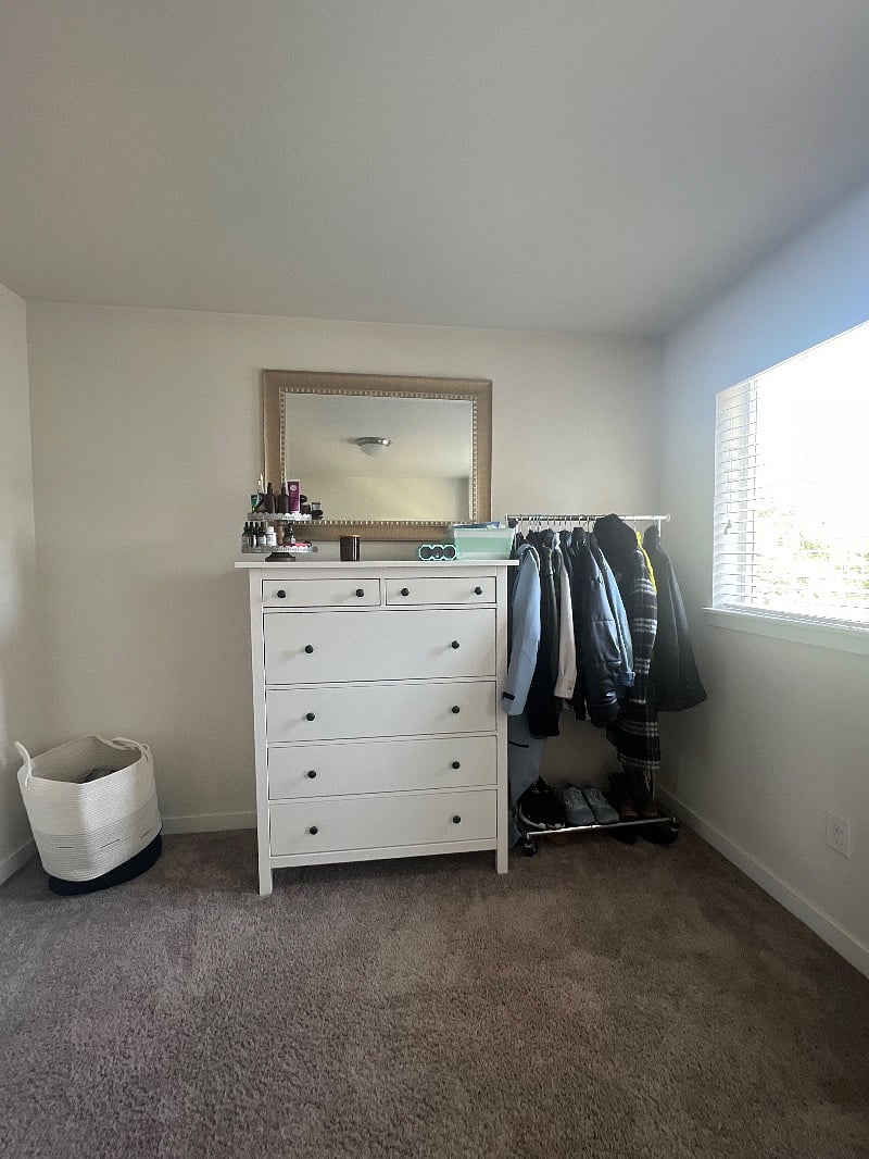 There is a dresser, laundry basket and a clothing rack. The room is occupied by a tenant in these photos. All personal items will be removed for the new tenant.