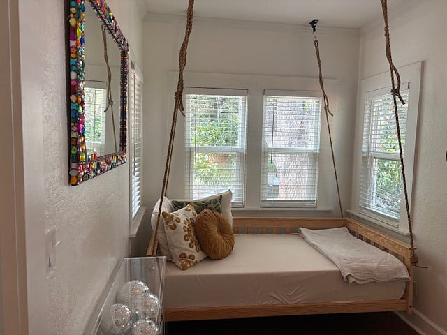 Bedroom with picture windows overlooking Roser Park, Home with Central AC and added window units to bedrooms for extra comfort, Single bed