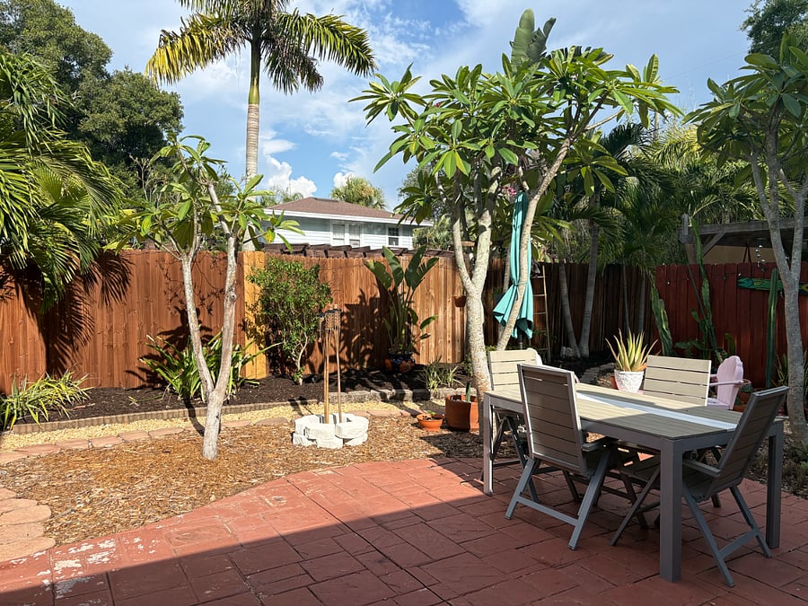 Large outdoor space with dining, outdoor shower