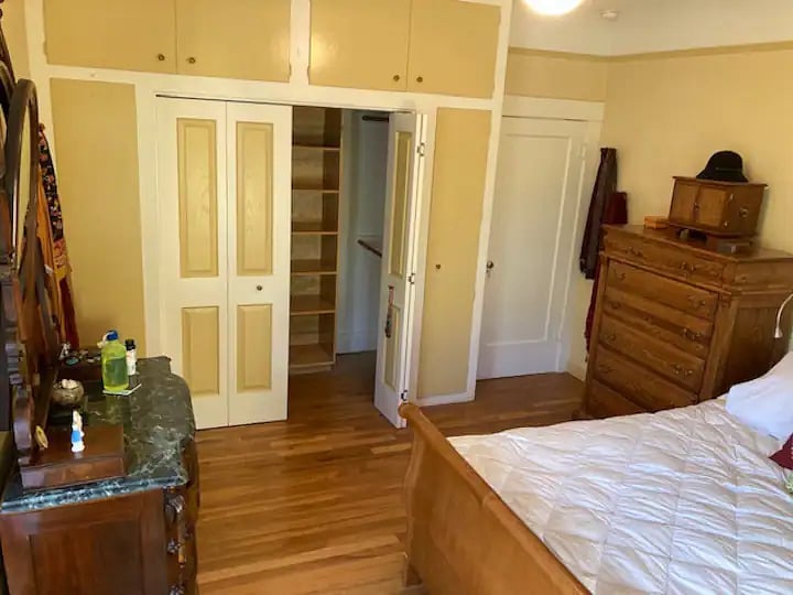 Master bedroom from bay windows to door, bathroom and hallway.