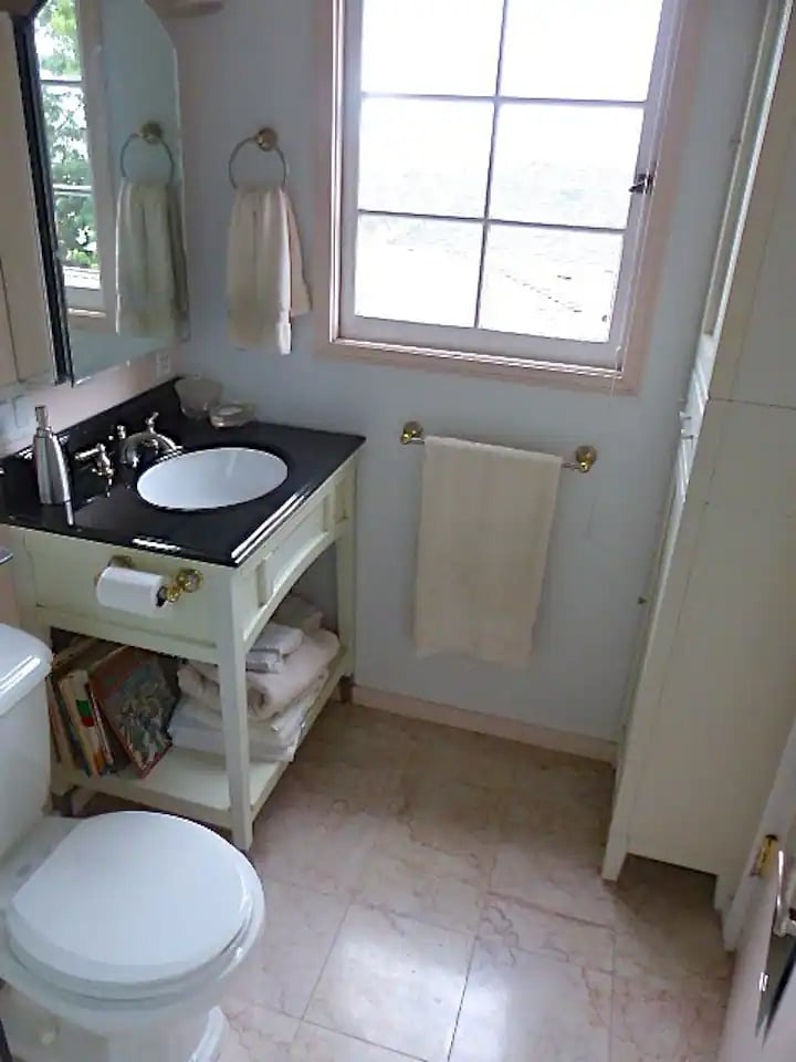 Bedroom 2 bathroom in railroad pattern, period tiling, granite, tiled flooring.