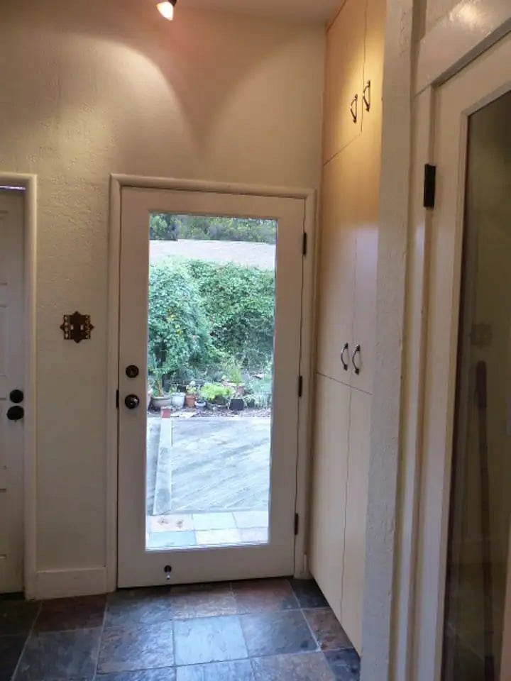 Back yard from pantry through glass door.