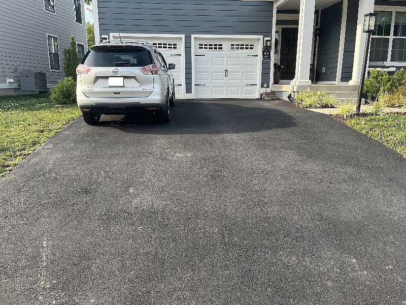 Left side of driveway included (room for two cars, one behind the other)