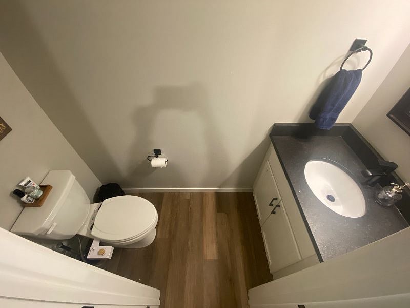 Half bath in downstairs near the door attached to the garage.