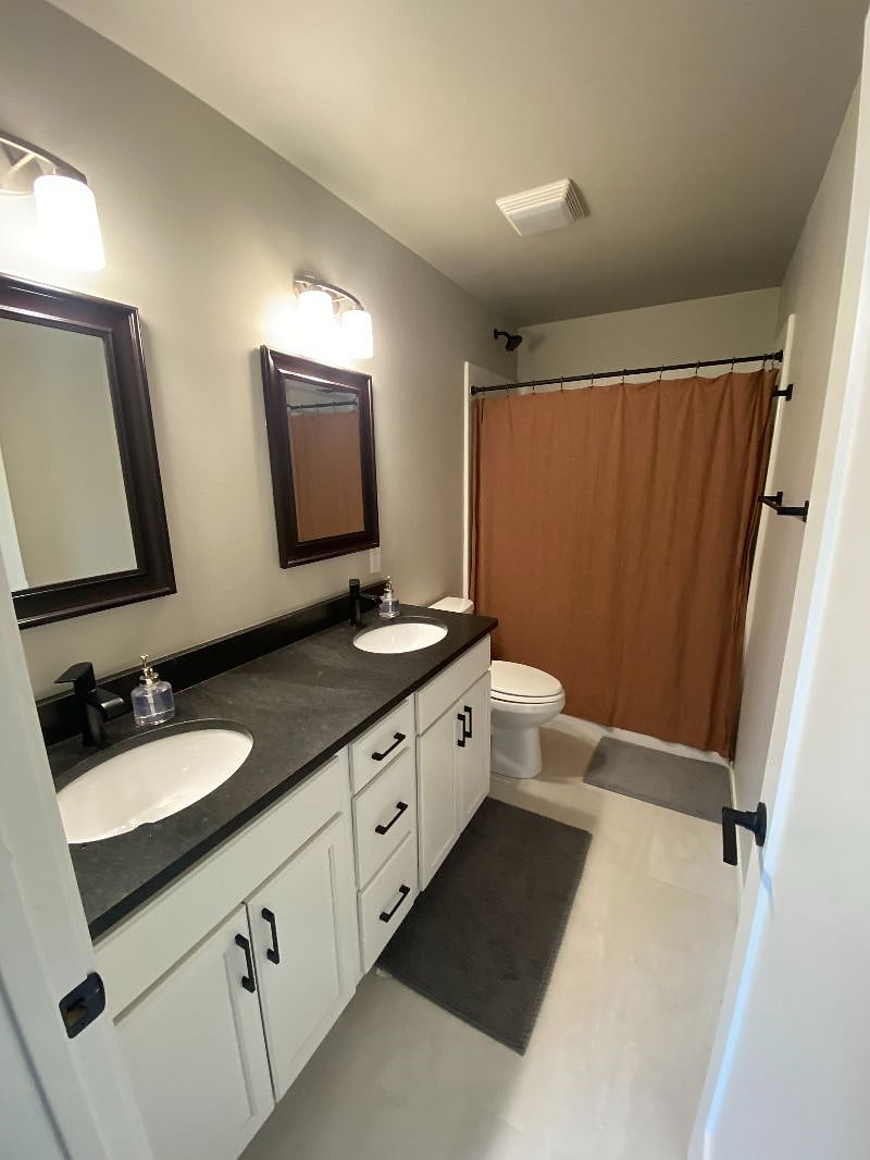 Master bath with double sink & large shower.View
