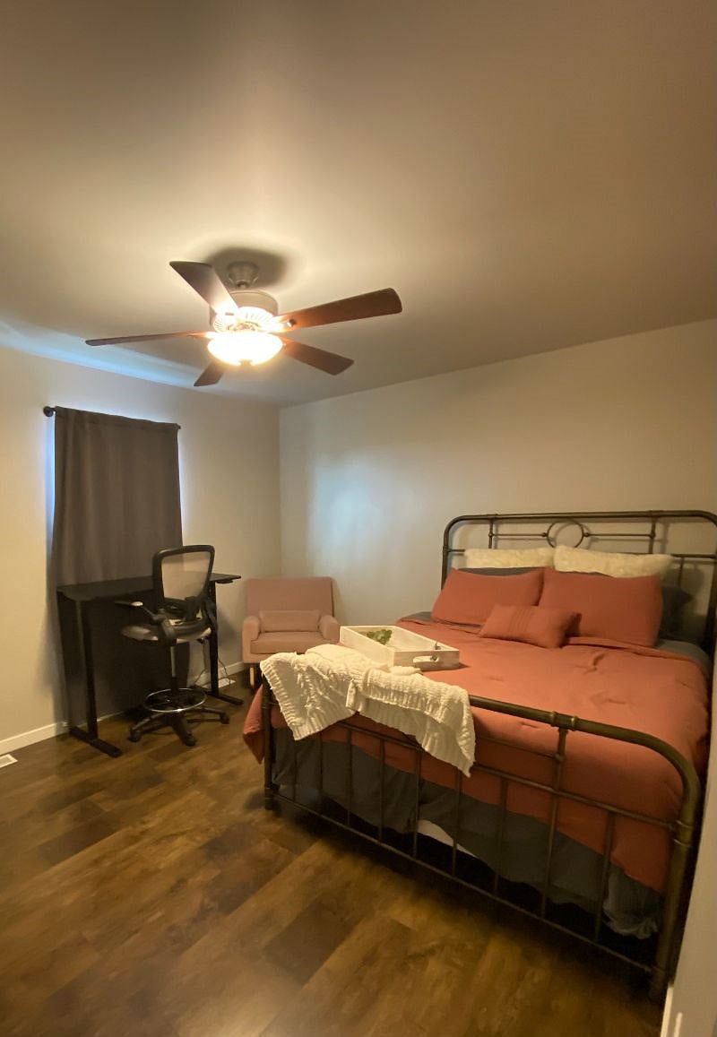 Upstairs: guest room with standing desk & rocking chair.