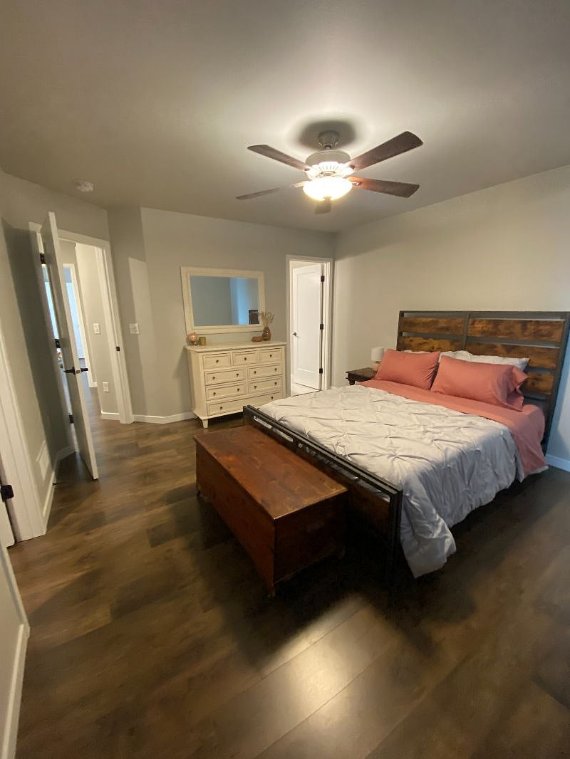 Upstairs: master bedroom with large window on opposite wall for natural light, large walk-in closet, and large master bathroom attached.