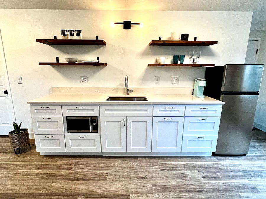 Kitchenette equipped for light cooking. Includes Breville toaster oven, hot plate burners, and all kitchenware. 