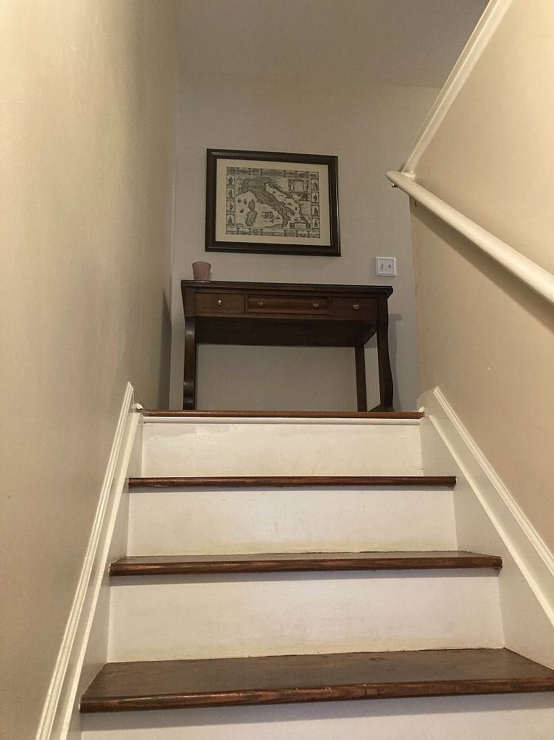 Stairs leading to three bedrooms, 2 full bathrooms, and laundry.