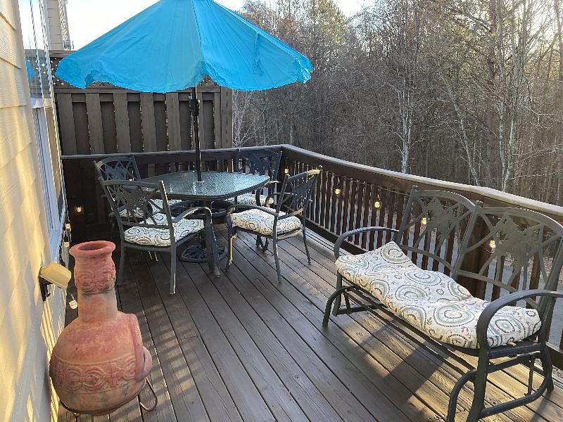 Deck off back of town home.