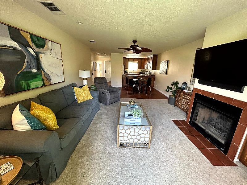 Professionally decorated living space with extra cube seating. 