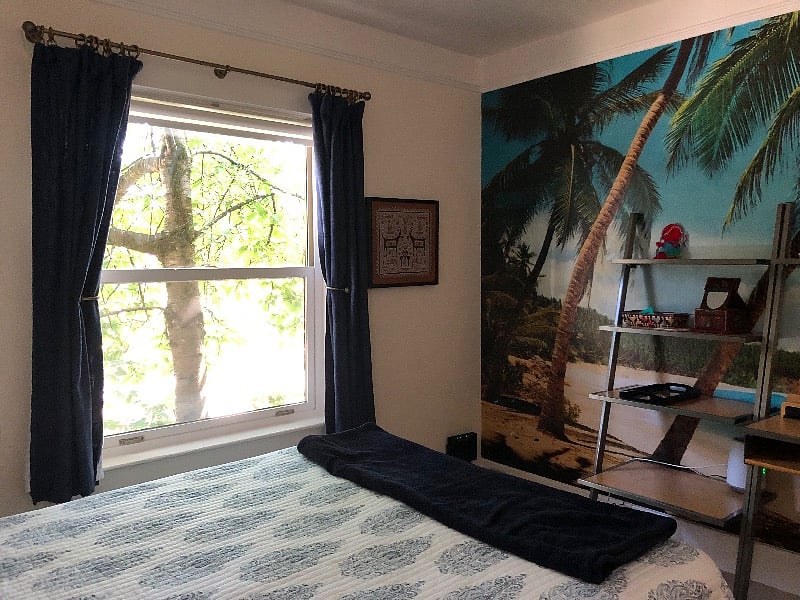 Front bedroom has photo mural of a tropical beach :-)