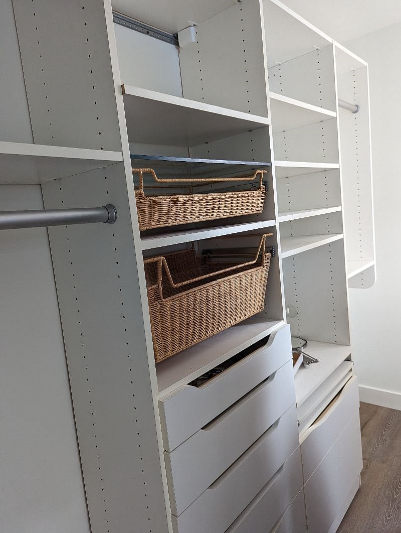 Primary bedroom has ample closet organizer with room for computer built into it