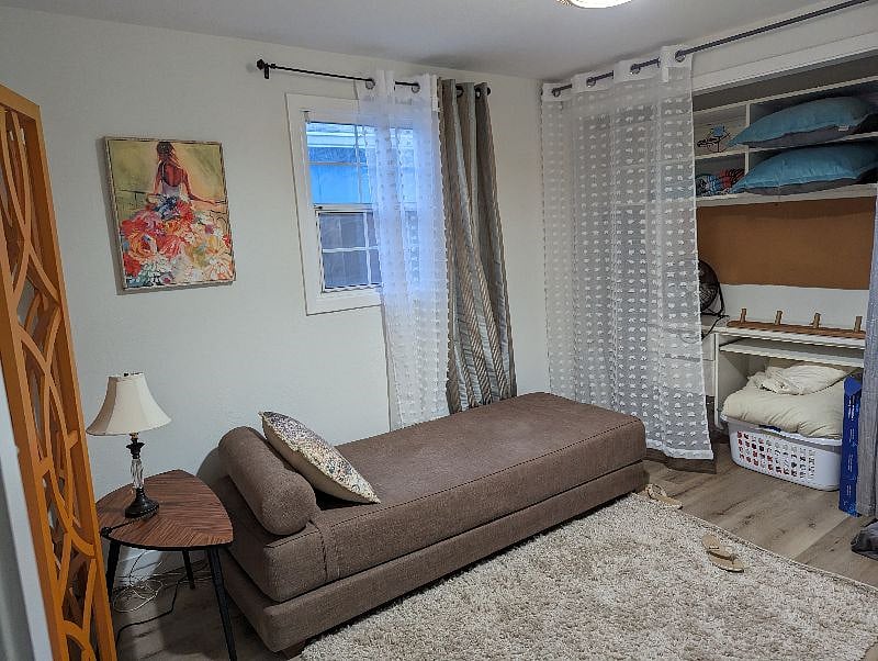 Smaller of the two bedrooms includes access to laundry area. Daybed can convert to Queen. Ample closet space with built in desk and full size dresser, not pictured.