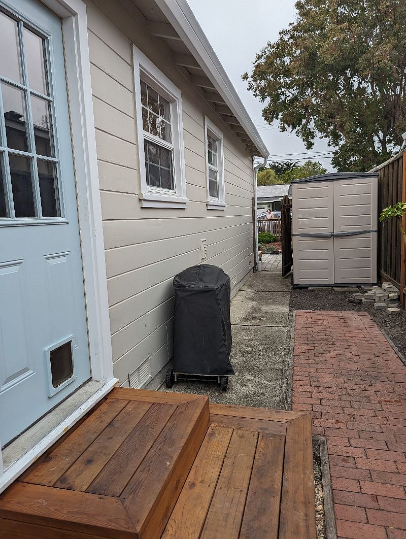 Side yard access to front gate and back hard