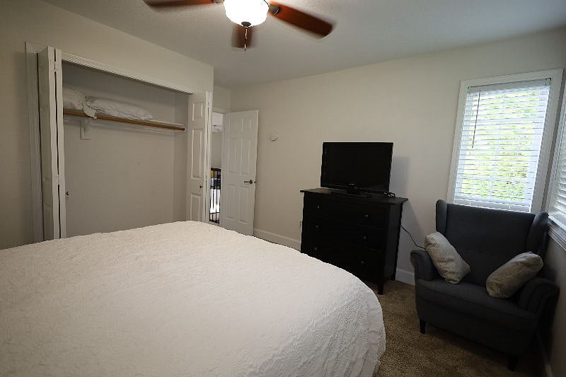 Bedroom-3, 12'x11', Queen bed, dresser, chair, 32" TV, closet, end tables with lamps
