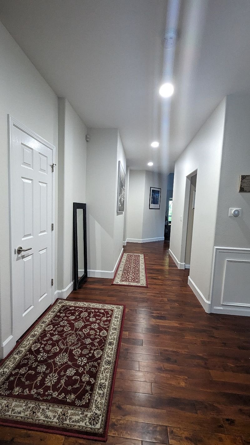 Hall way from entrance to the kitchen, informal living room, Master Bedroom