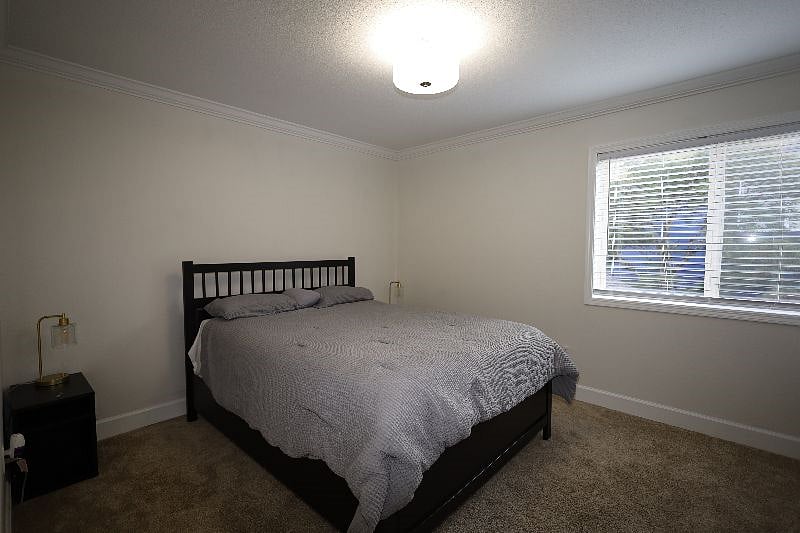 Bedroom-4, 12'x11', Queen bed, closet, end tables with lamps
