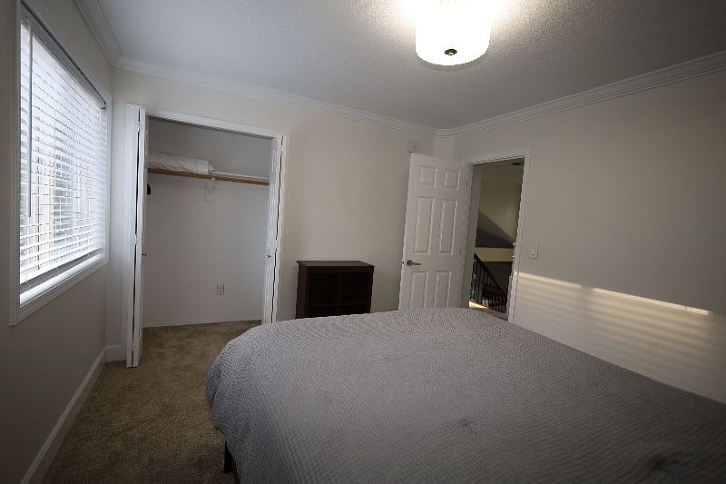 Bedroom-4, 12'x11', Queen bed, closet, end tables with lamps
