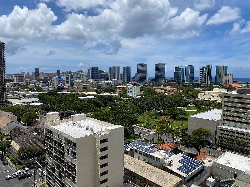 View of downtown Honolulu, Thomas Square (Hawai'i's oldest city park), and Waikiki in the distance.
