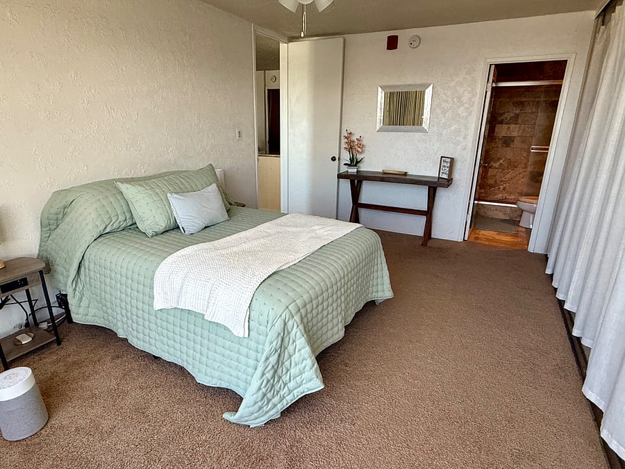 Pull back the blackout curtains to let in the natural light.