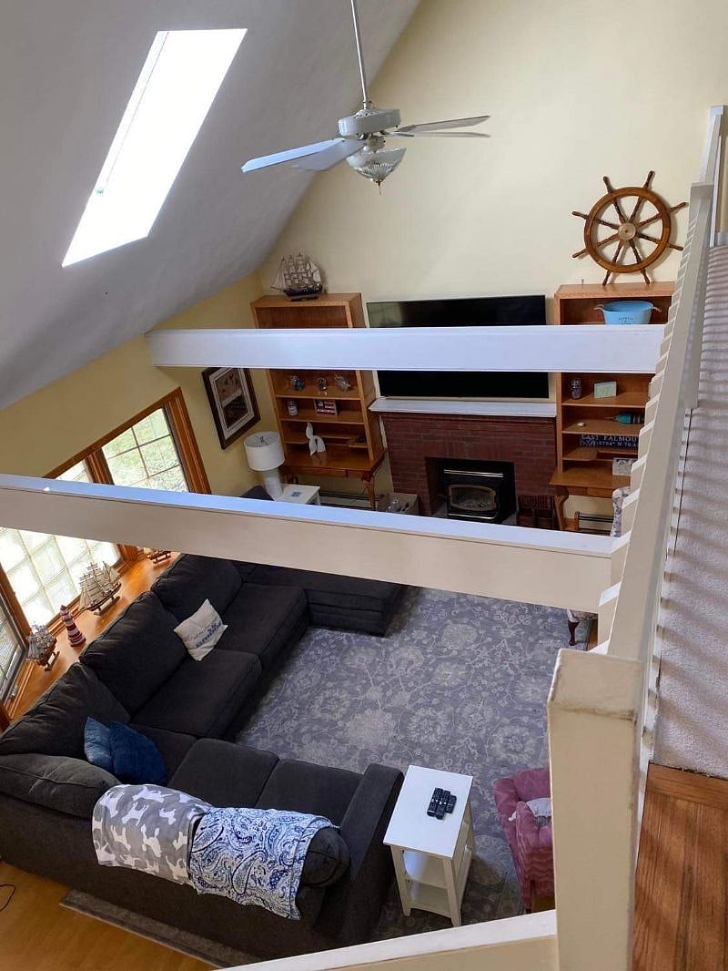 view looking down from top of the stairs in the loft area