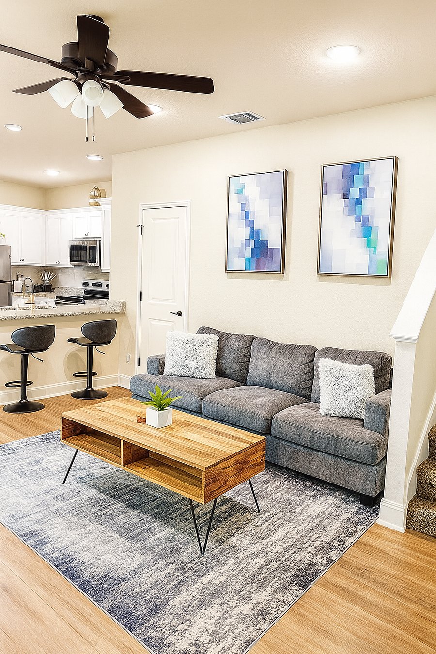 Gather the family for a movie night on the 65-inch Samsung Smart TV or get competitive with our collection of board games. The comfortable sofa and natural light create a welcoming atmosphere, while the ceiling fan ensures your comfort.