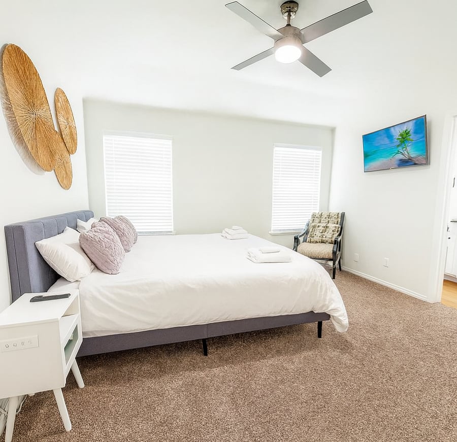 Main bedroom + private full bathroom. Relax & sleep on a memory foam bed. Watch your favorite shows on 40-inch Smart TV. Personalize your comfort with a ceiling fan remote and dimmable light. Built-in nightstand outlets for your devices.
