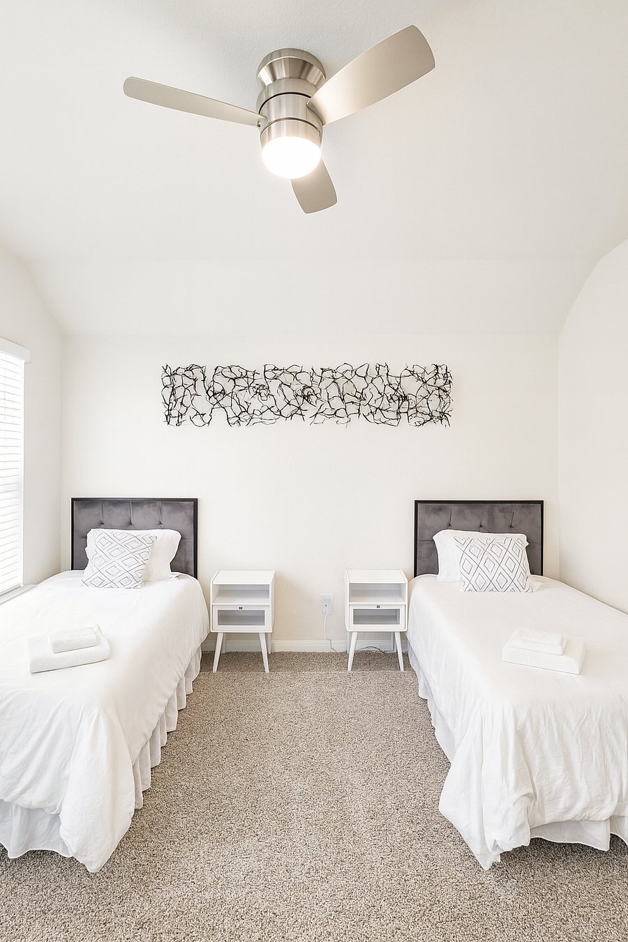 This sun-filled bedroom is perfect for friends or family with two twin XL beds (memory foam mattresses). Personalize your comfort with a ceiling fan remote and dimmable light. Plus easy-access electrical outlets for all your devices.
