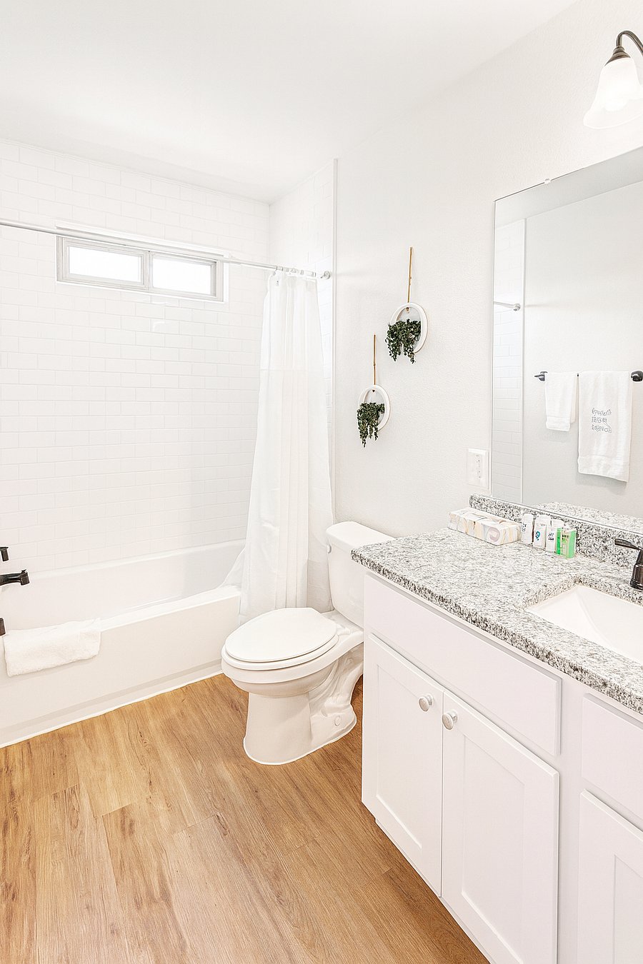 2 full bathrooms + half-bathroom Two fully equipped bathrooms with a shower/tub combination. We provide essential toiletries including shampoo, conditioner, and body wash, along with fresh towels, shower caps, toilet paper, and tissue.