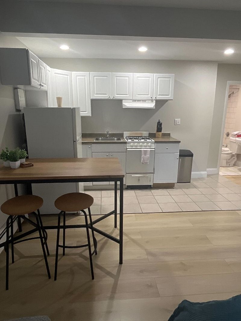 Full size fridge, oven, and storage.